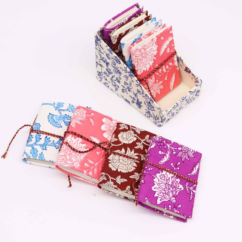 Assorted floral-print cotton-bound notebooks, 7 x 10 cm (display pack)