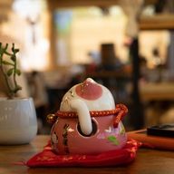 Ceramic Money Cat Moving Hand - Pink on Cushion (battery not included)